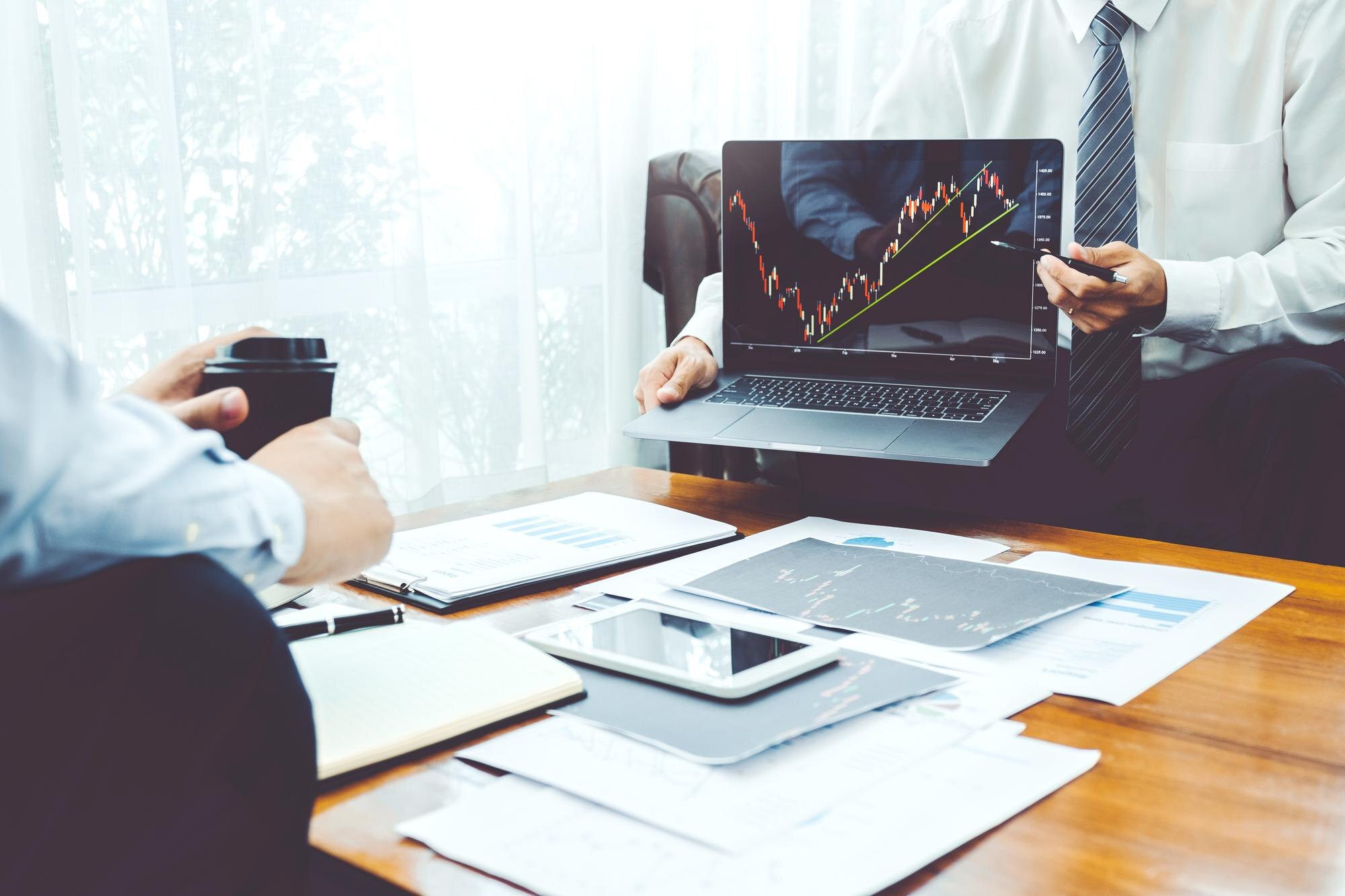 Team collaborating on investment analysis